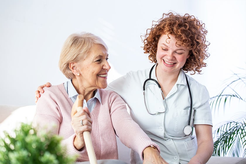 young-caregiver-and-senior-woman-laughing-together-1
